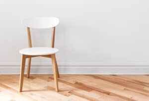 white chair on a hardwood floor